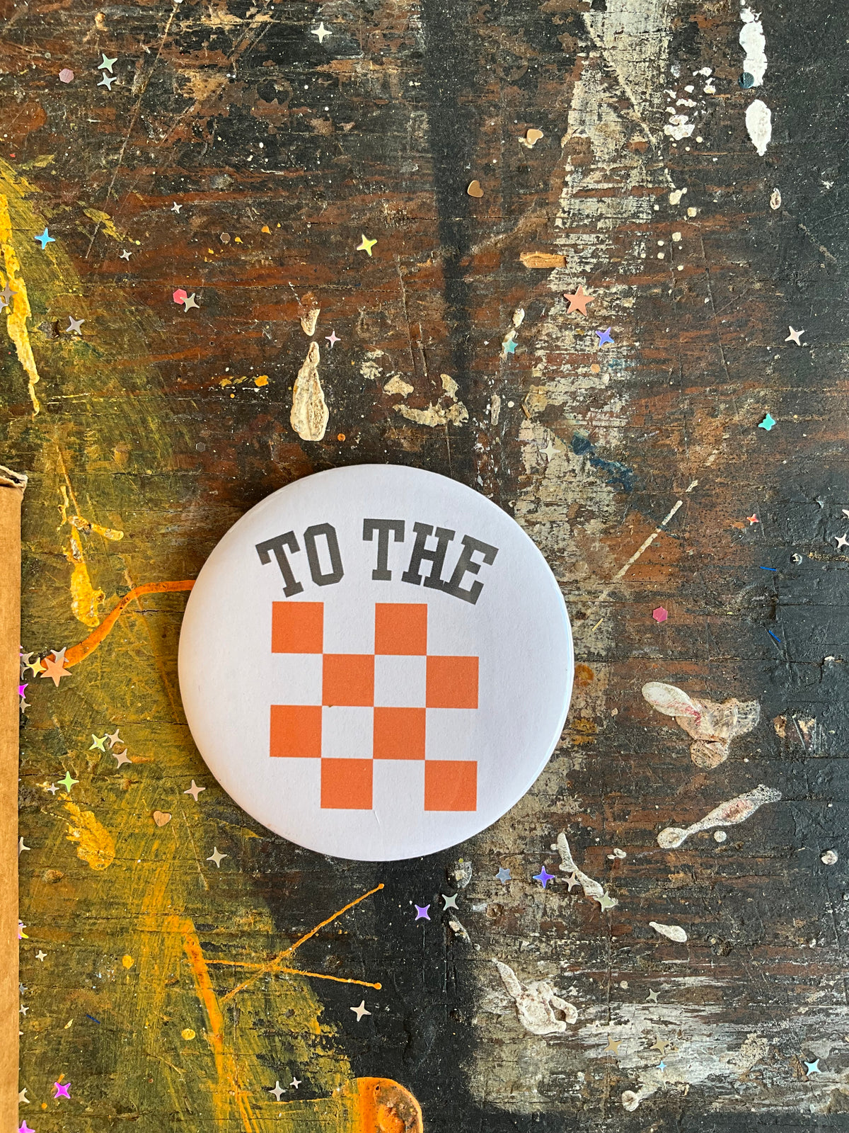"TO THE {checkerboard}" button