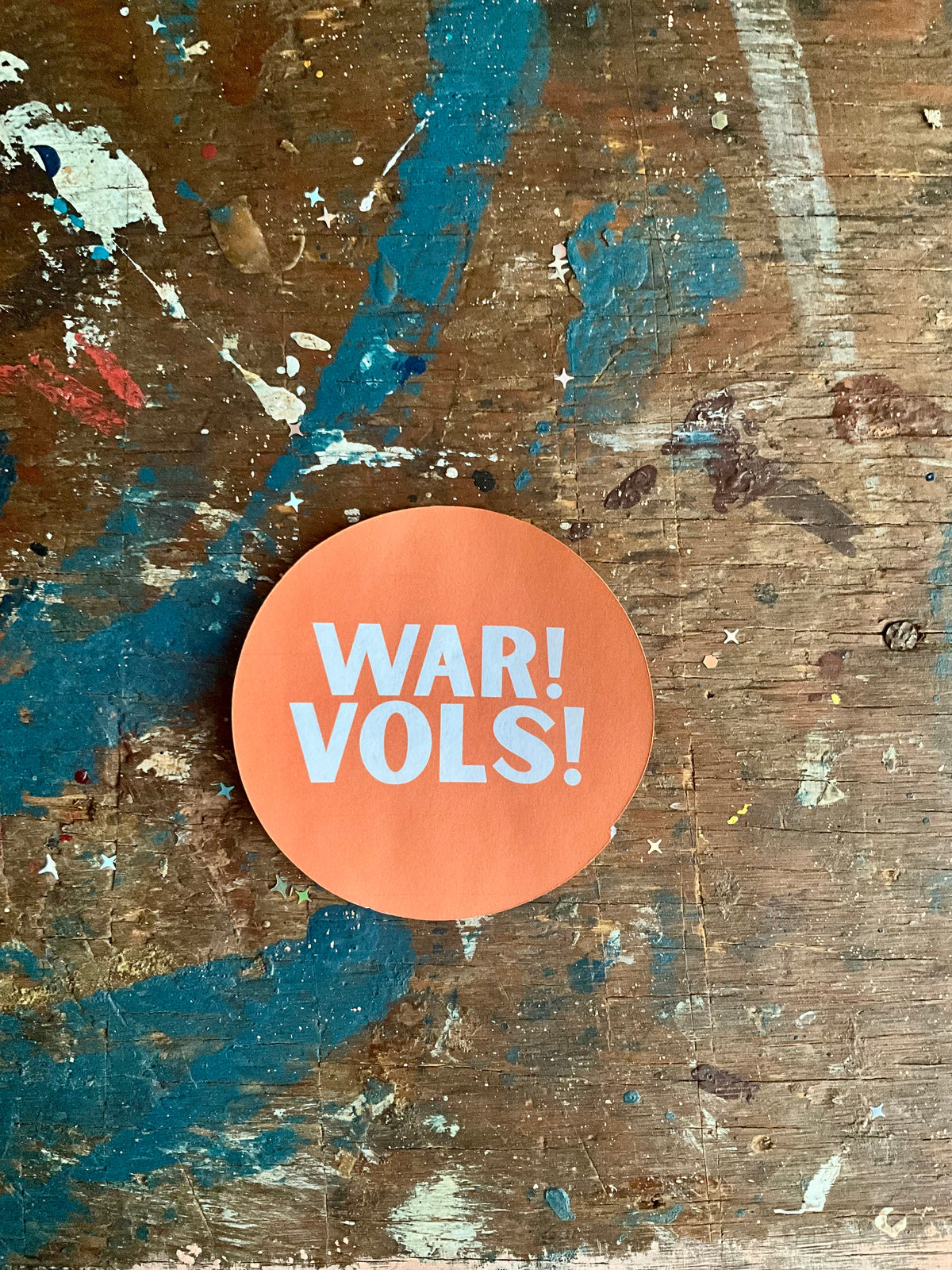 "WAR! VOLS!" white letters on orange button