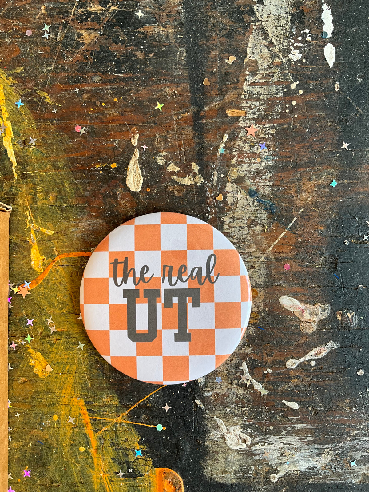 "the real UT" orange/white check button