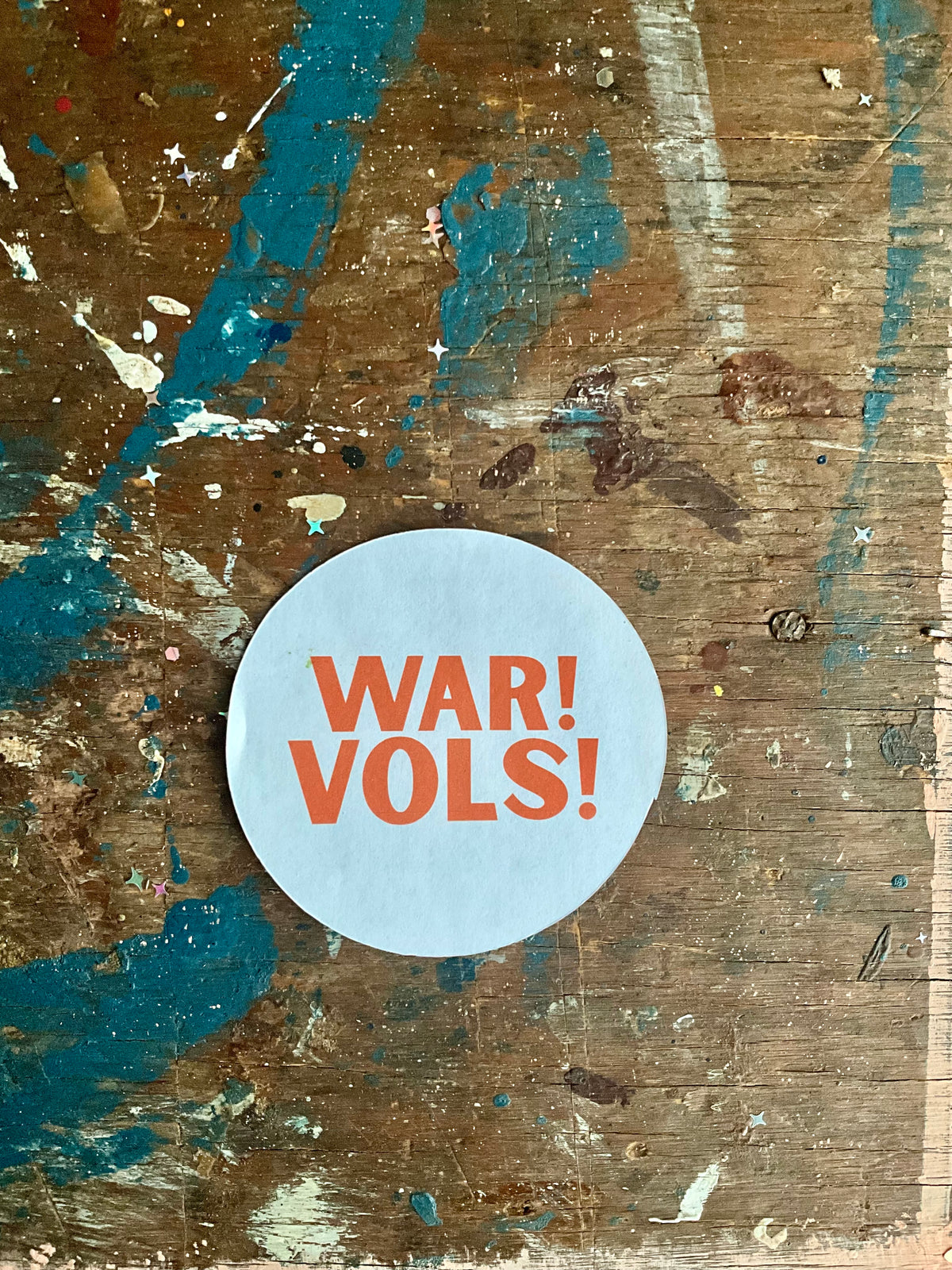 "WAR! VOLS!" orange letters on white button
