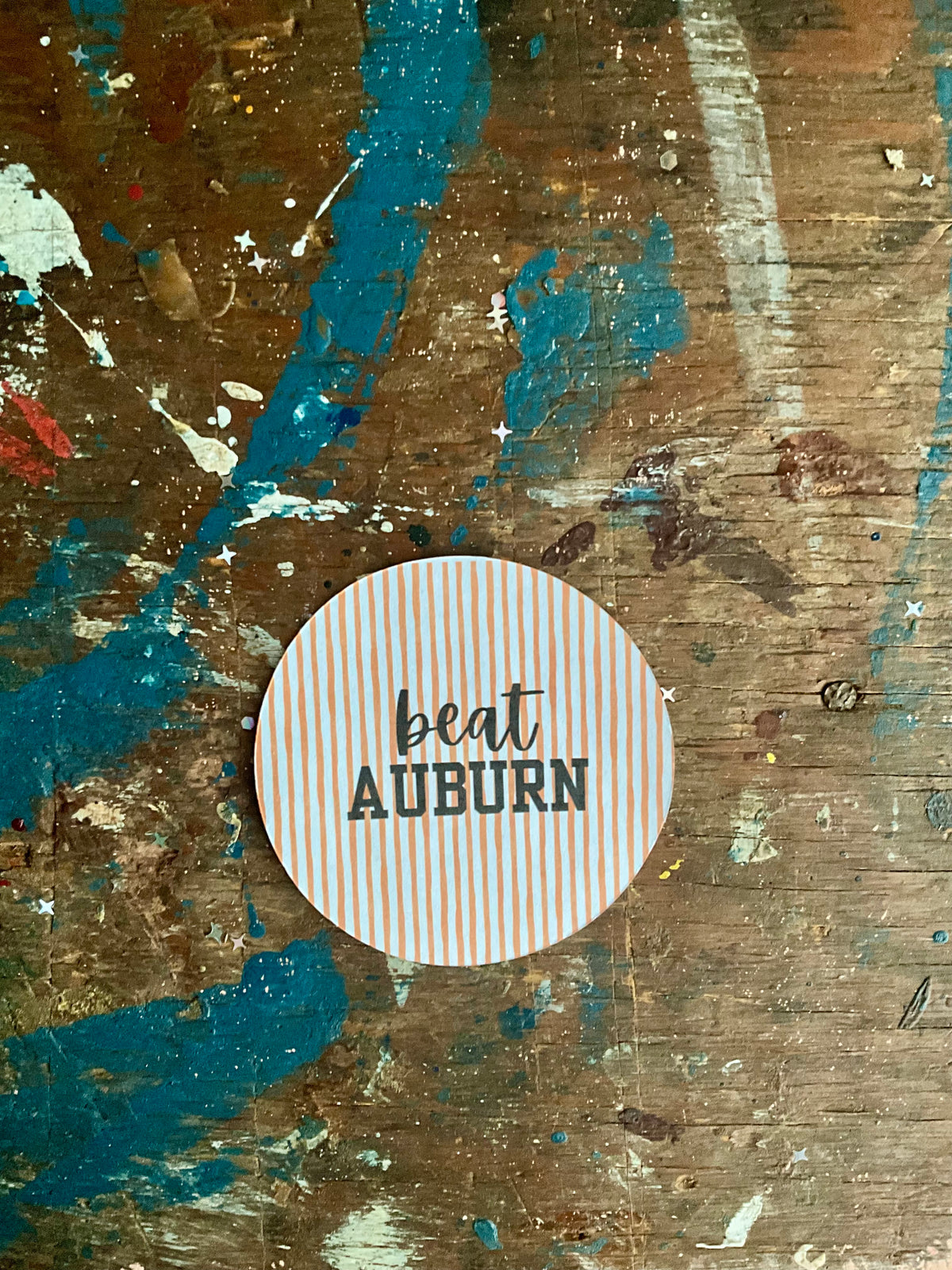 "beat AUBURN" orange/white stripes button