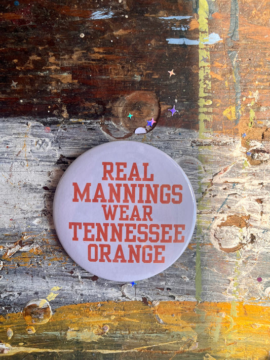 "REAL MANNINGS WEAR TENNESSEE ORANGE" orange letters on white button