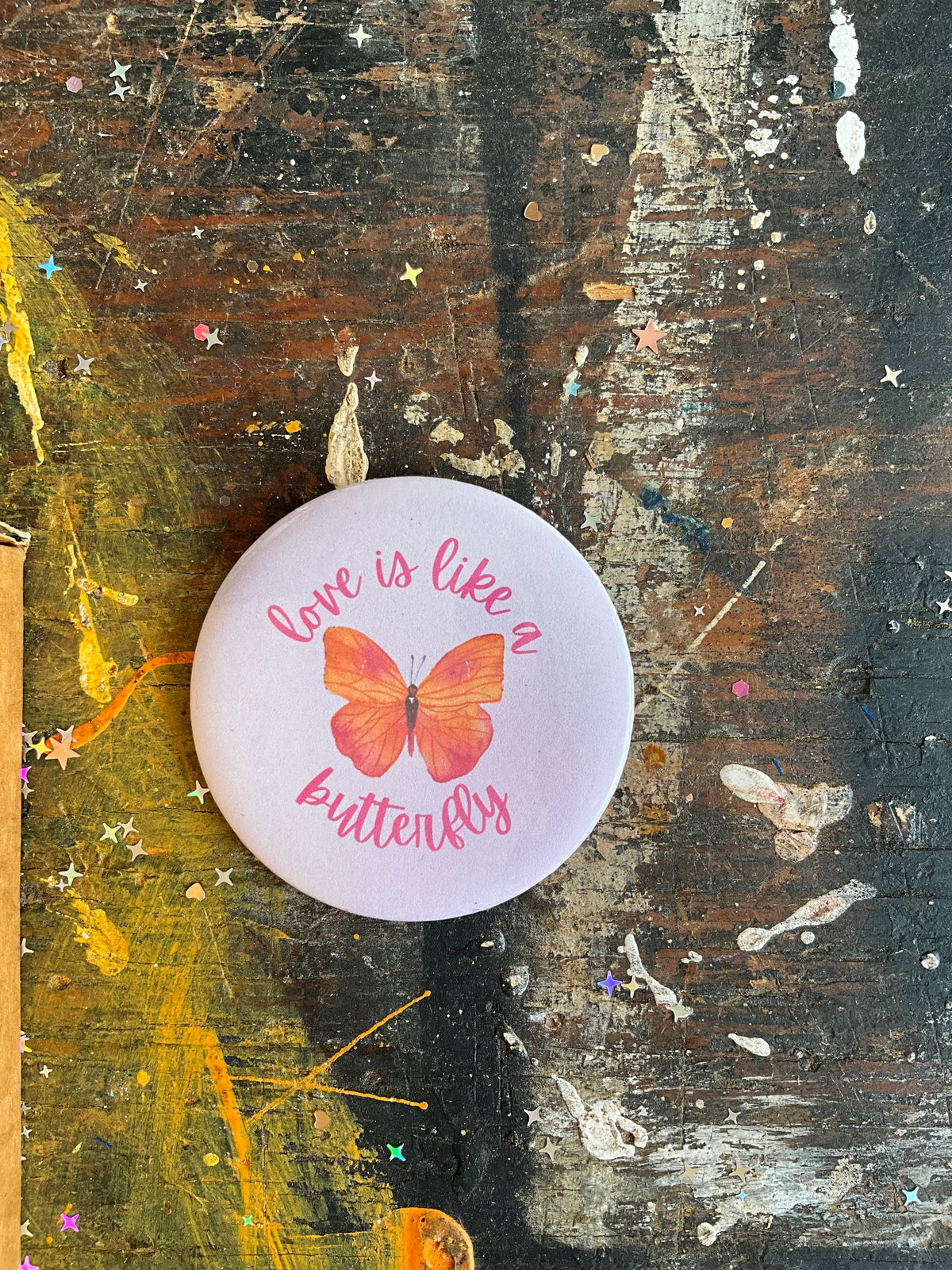 "love is like a butterfly" orange/pink Dolly button