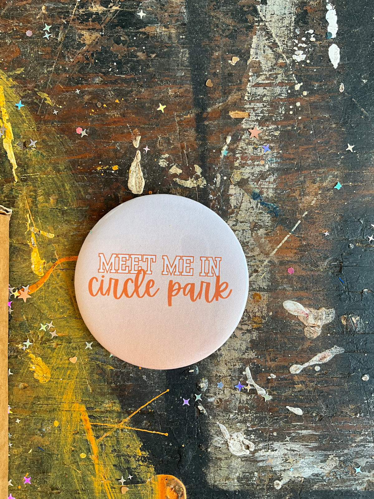 "MEET ME IN circle park" cursive letters button