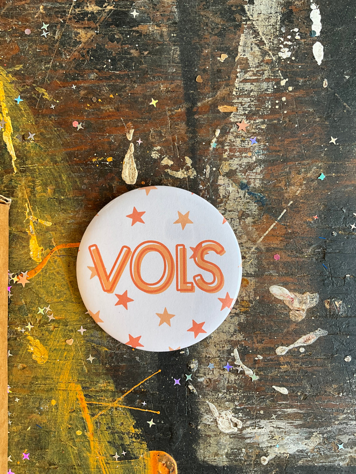 "VOLS" orange w/ stars button